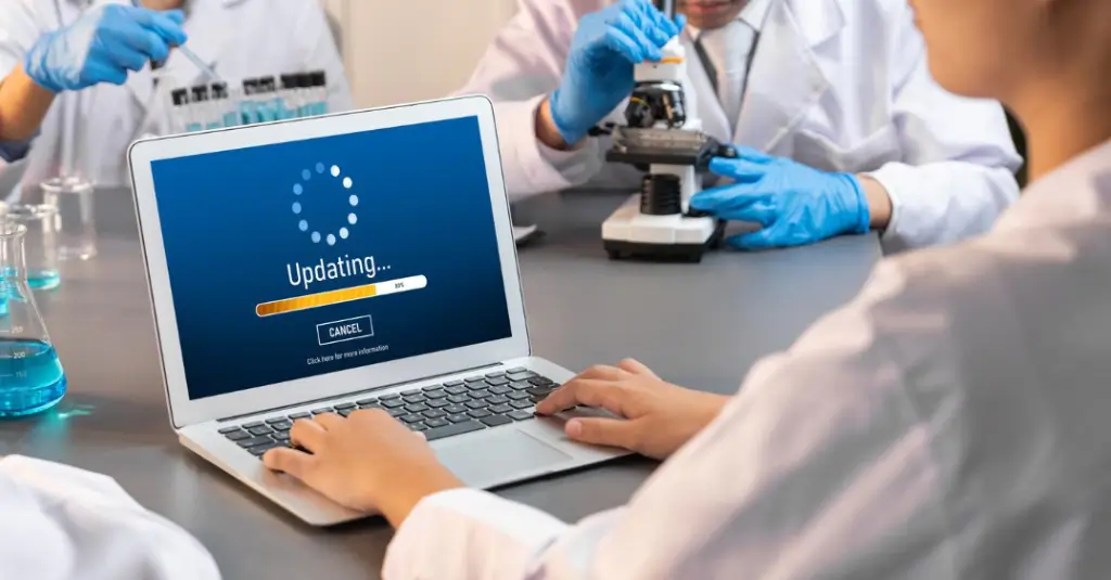 Laboratory staff updating CLIA compliance digitally in 2026, highlighting the shift from paper processes to electronic systems.