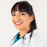 Smiling female doctor in a white coat with stethoscope, representing a happy Human Medical newsletter subscriber.