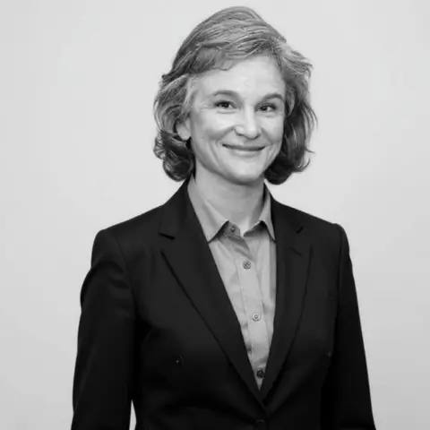 Kara Wily, Business Development Strategist and author at Human Medical Billing, smiling in professional attire.