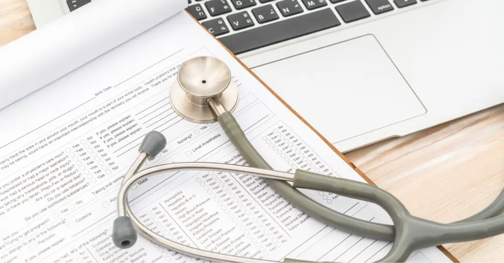 Stethoscope on medical form beside laptop illustrating Medicare Advantage SNP billing documentation – Human Medical Billing