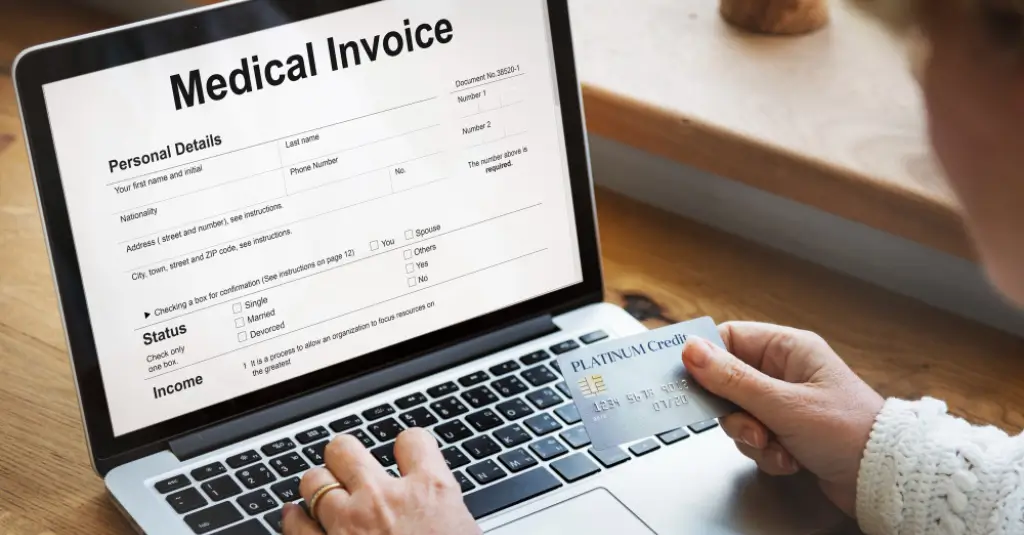 Online medical invoice payment with credit card on laptop, illustrating patient billing process for the blog What is Medical Billing by Human Medical Billing.
