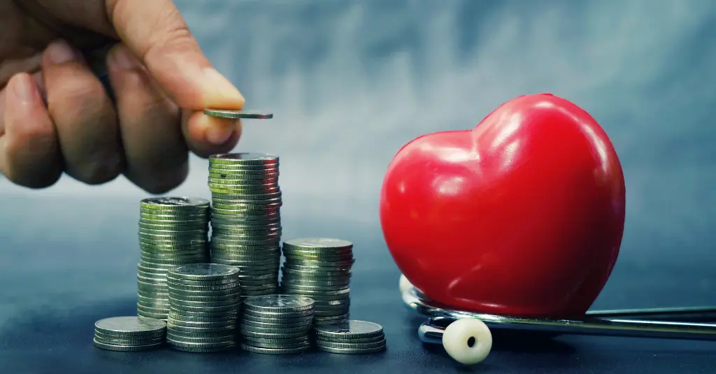 A hand stacking coins beside a red heart and stethoscope, symbolizing private equity investment in outpatient cardiology and healthcare finance.